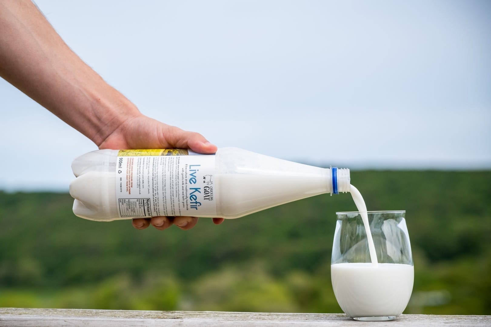 Chuckling Goat kefir being poured into a glass