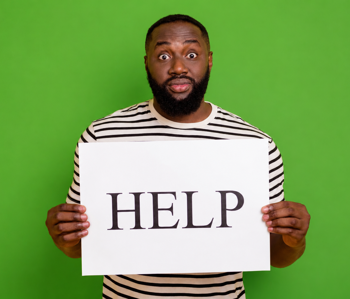 Holding up help sign, shocked face, green isolated background