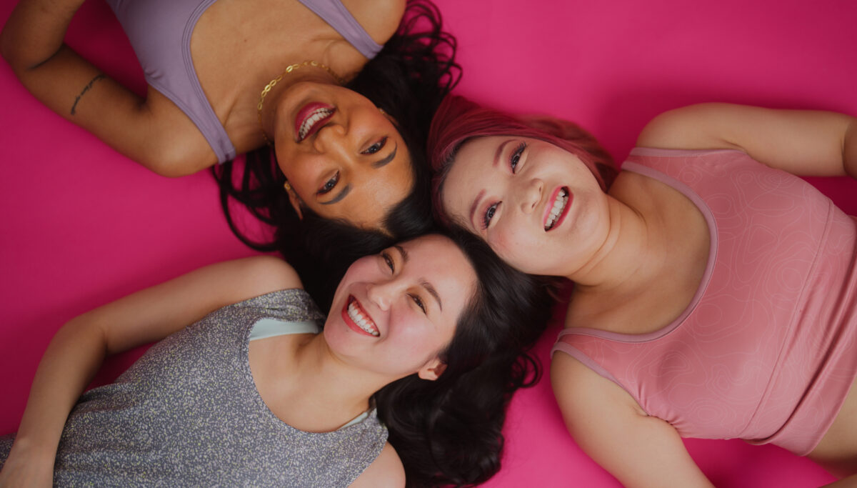 Female diverse friends are working and posing for the camera in a studio environment. Female friendships. Galentine's Day.