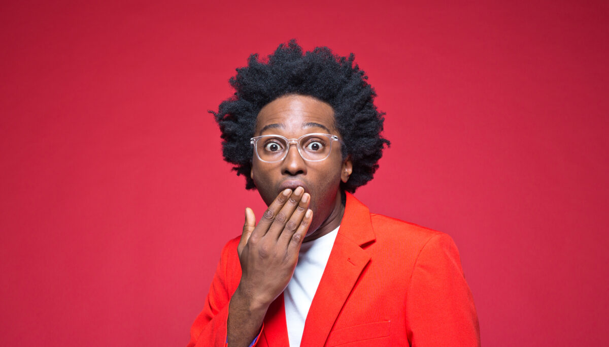 Man covering mouth with hand
