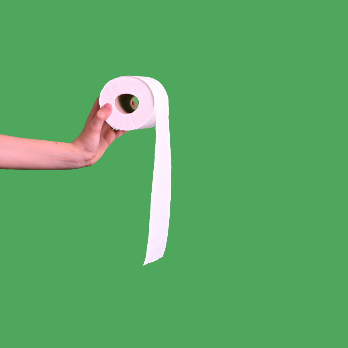Minimalist hand holding toilet paper on green background, constipation concept